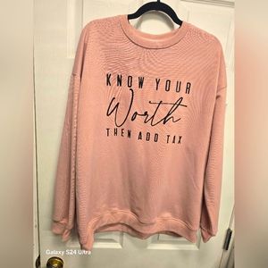 Womans light pinkish sweater